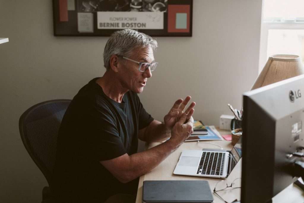 Jim Morris sitting at a desk indoors