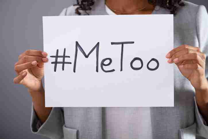 "MeToo + Epstein Files" sign held by womans hands
